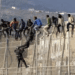 Ascienden a 18 los migrantes muertos tras el intento de salto masivo a la valla de Melilla